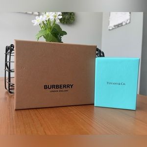 Burberry box with cloth and Tiffany jewelry box with padding inside